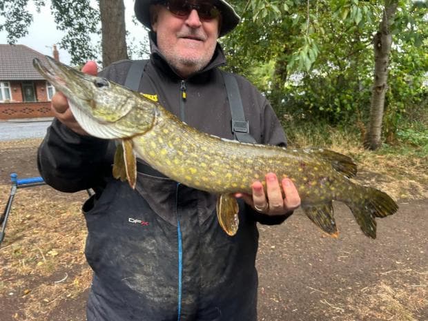 Andy Corr with the pike he caught in the Bridgewater Canal